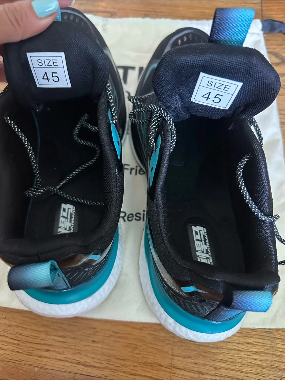 Orthora Black Sneakers with Teal Accents